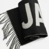 L’écharpe Jacquemus Écharpe à logo frangé L’écharpe Jacquemus Écharpe à logo frangé