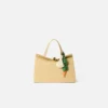 La carotte Charm pour sac en forme de carotte nouée La carotte Charm pour sac en forme de carotte nouée