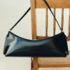 La pochette Ovalo Sac à bandoulière plié