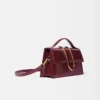 Le grand sac à bandoulière Bambino à rabat métallique
