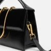 Le grand sac à bandoulière Bambino à rabat métallique