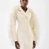 Le manteau Boa Manteau Boa en peau lainée