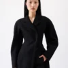 Le manteau Curvo Manteau à épaules arrondies