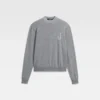 Le pull ajusté en tricot monogrammé Le pull ajusté en tricot monogrammé