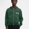 Le sweat à capuche zippé Gros Grain Sweat à capuche zippé avec logo Grosgrain