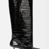 Les bottes hautes Tourni Bottes larges montant jusqu’aux genoux Les bottes hautes Tourni Bottes larges montant jusqu’aux genoux