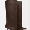Les bottes hautes Tourni Bottes larges montant jusqu’aux genoux Les bottes hautes Tourni Bottes larges montant jusqu’aux genoux
