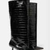 Les bottes hautes Tourni Bottes larges montant jusqu’aux genoux Les bottes hautes Tourni Bottes larges montant jusqu’aux genoux