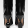 Les bottines Bisou Bottines à talons géométriques Les bottines Bisou Bottines à talons géométriques