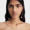 Les boucles d’oreilles Nodo Boucles d’oreilles pendantes ornées de strass Les boucles d’oreilles Nodo Boucles d’oreilles pendantes ornées de strass