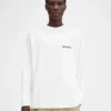 T-shirt à manches longues avec adresse imprimée T-shirt à manches longues avec adresse et logo imprimés – vendu exclusivement en ligne et dans notre boutique de Courchevel